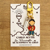 Carlo Acutis enamel keychain charm with carabiner clasp on illustrated presentation card — VII Sacramentos Catholic gifts from Colombia